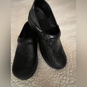 Size 37 Dansko Nursing Clogs in Black with embossed paisley.